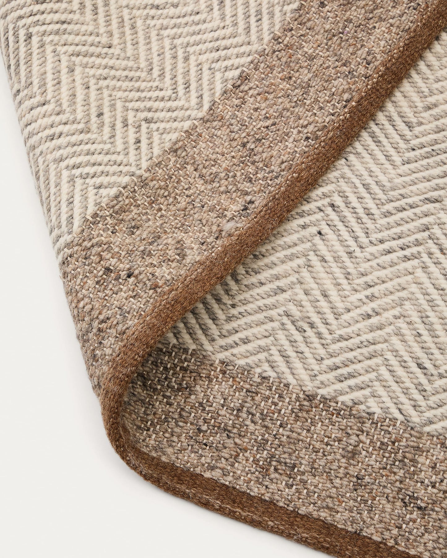 Tappeto Nifelia jacquard in lana beige 160 x 230 cm